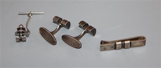 A pair of Georg Jensen sterling cufflinks and dress stud, design no. 67 and a similar tie clip, design no. 74B.